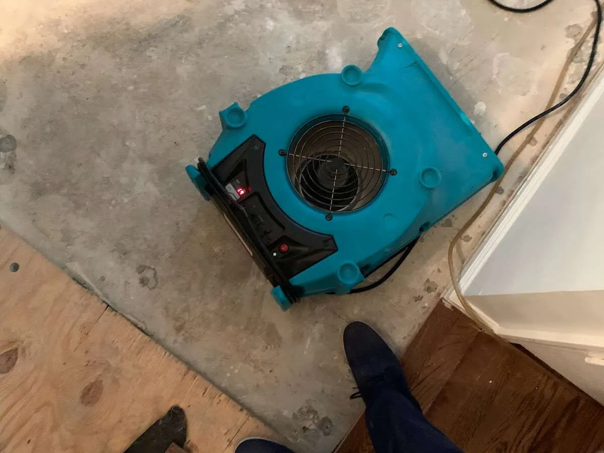 Air mover drying subfloor during Leak Detection & Repair in Dallas